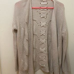 Beige cardigan with detailed back. Size large.